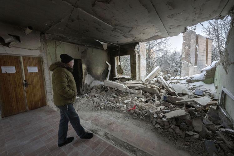 Oleksandr Tertyshnyi, head of the Kharkiv region military administration in Borova, looks at the remains of his office last month after a Dec. 4 Russian drone attack.